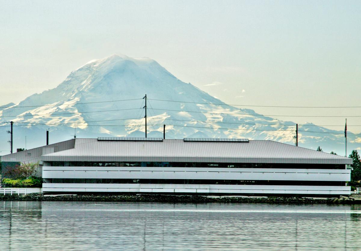 photo of an office building in front of a mountain